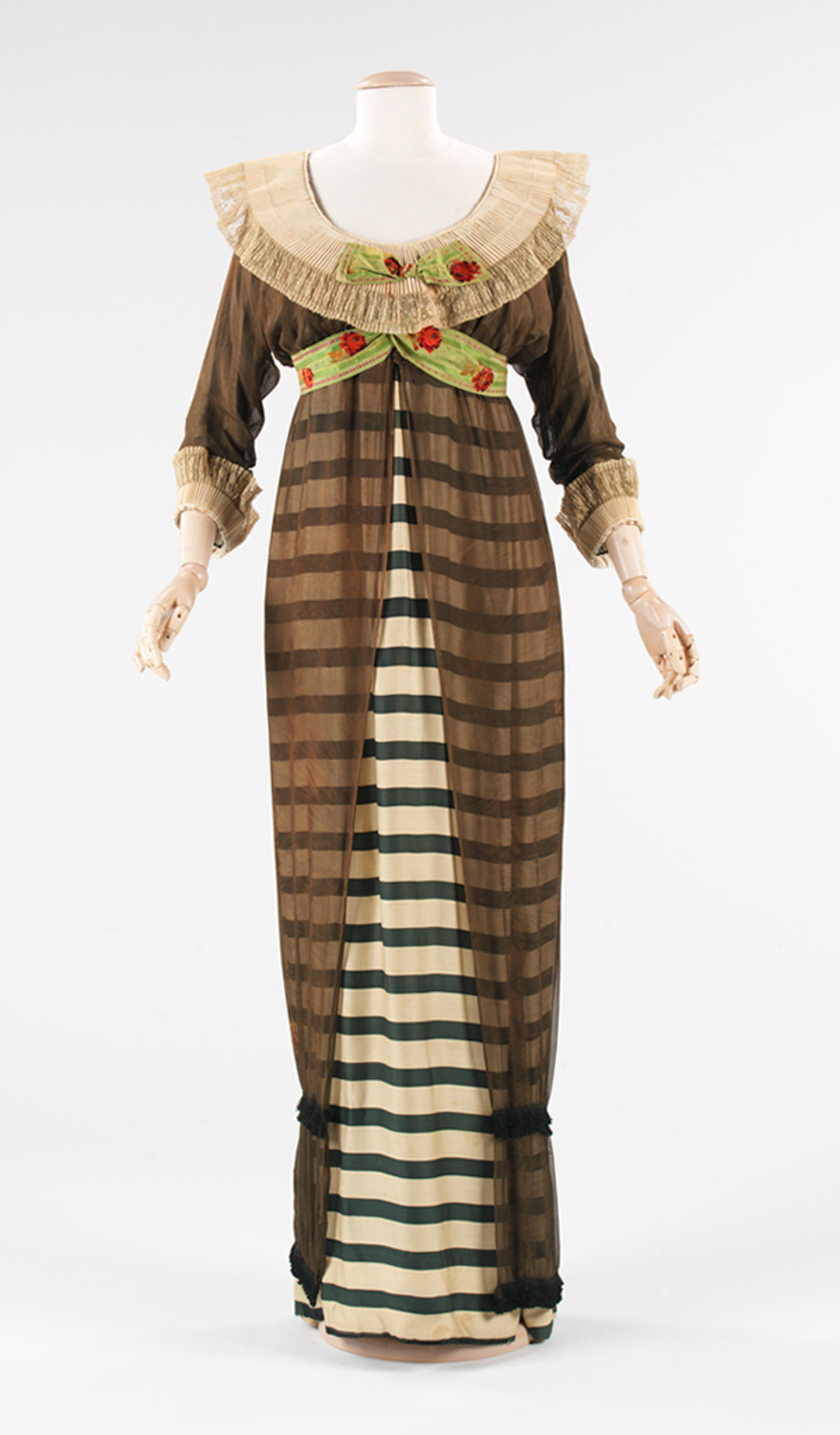 Paul Poiret (French, 1879–1944). Evening Dress, 1910. Forest green and ivory striped silk, black silk chiffon, white cartridge pleated linen, brocaded ribbon. Brooklyn Museum Costume Collection at The Metropolitan Museum of Art, Gift of the Brooklyn Museum, 2009; Gift of Ogden Goelet, Peter Goelet, and Madison Clews in memory of Mrs. Henry Clews, 1961 (2009.300.1289)