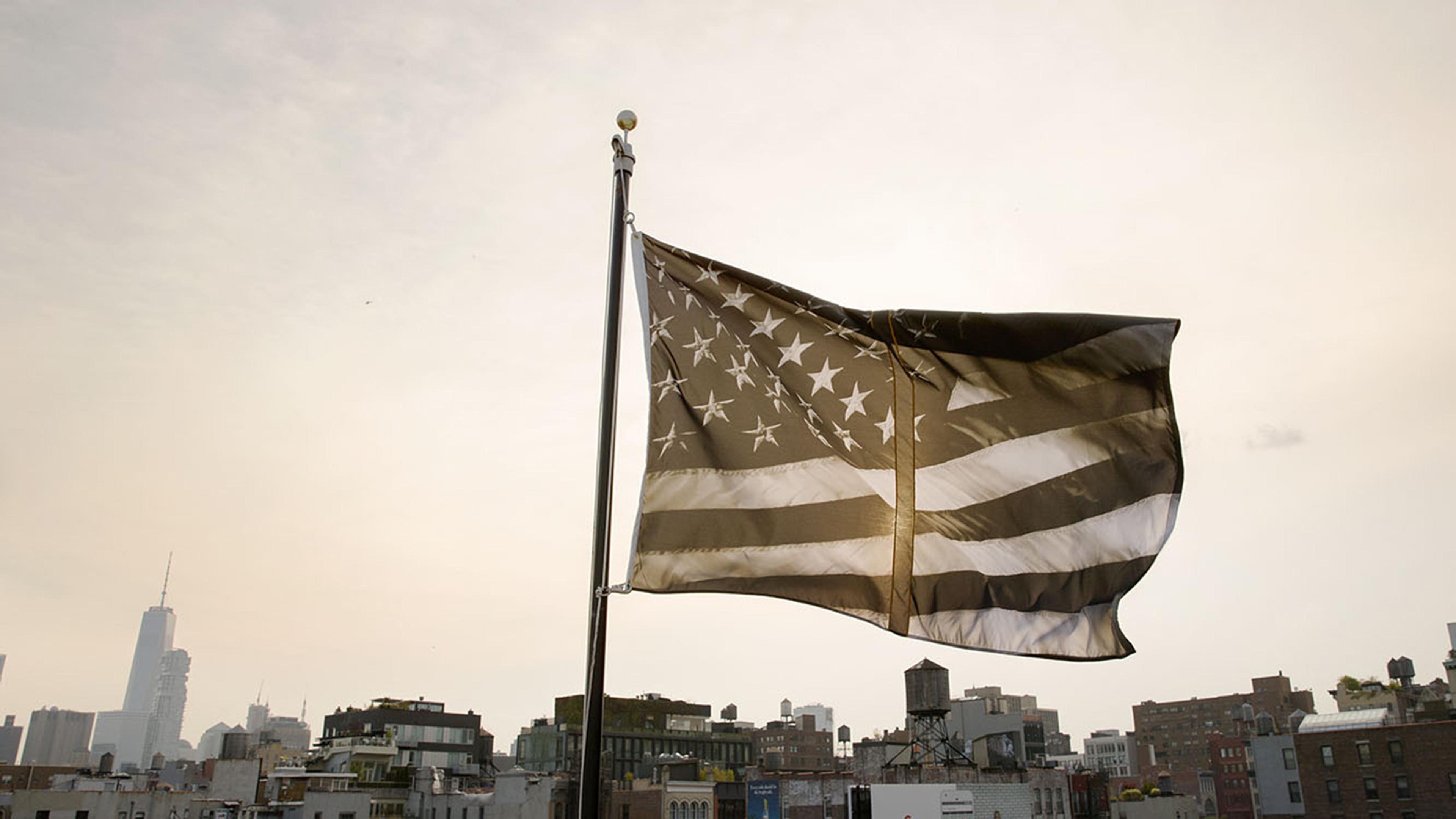 Robert Longo (American, born 1953). Untitled (Dividing Time), 2017. Nylon and polyester poplin, hand appliqué, 96 x 144 in. (243.0 x 365.7 cm). Courtesy of Creative Time’s Pledges of Allegiance