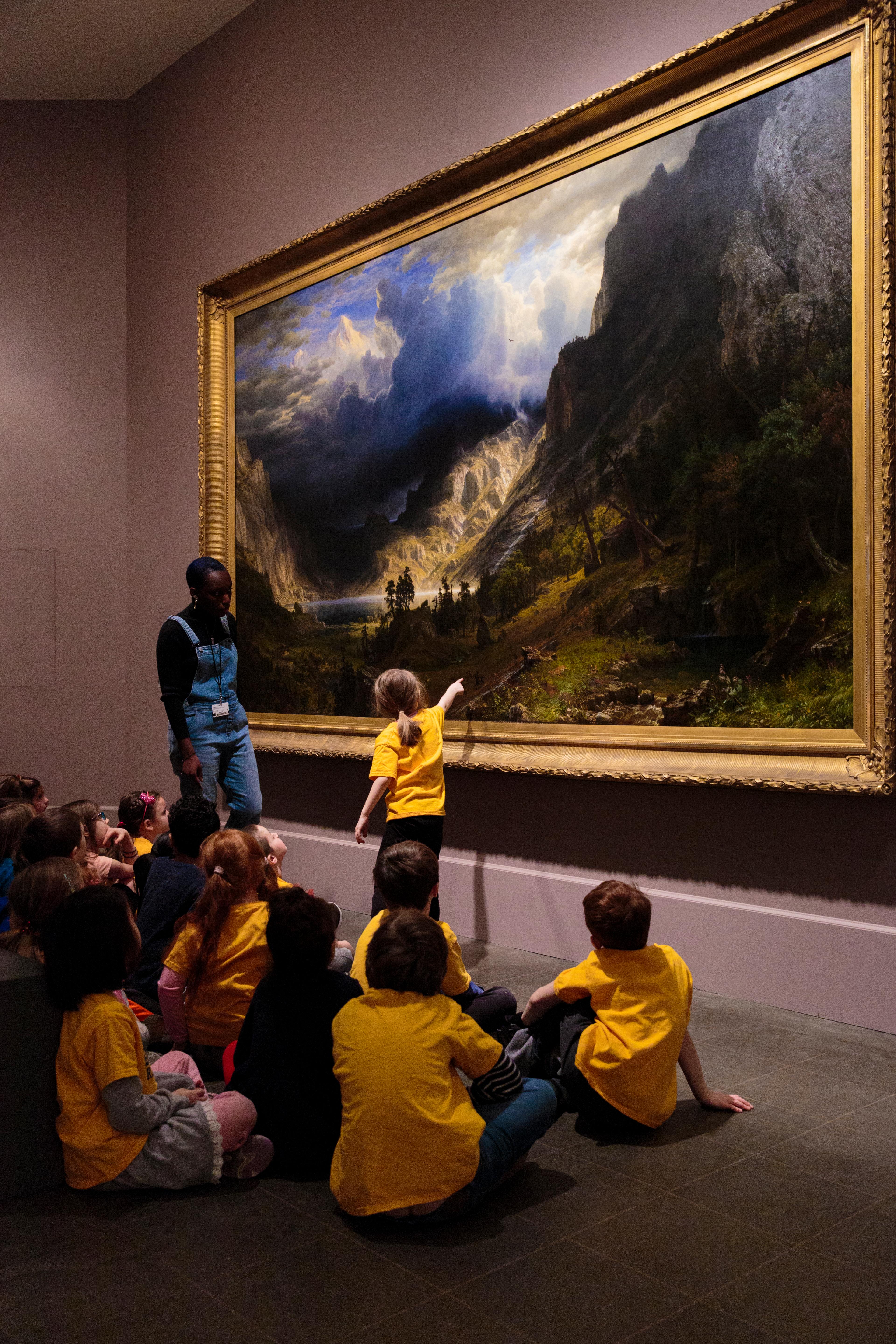 School group engages with Albert Bierstadt’s <i>A Storm in the Rocky Mountains, Mt. Rosalie</i> (1866) at the Brooklyn Museum, February 2018. (Photo: Kolin Mendez)