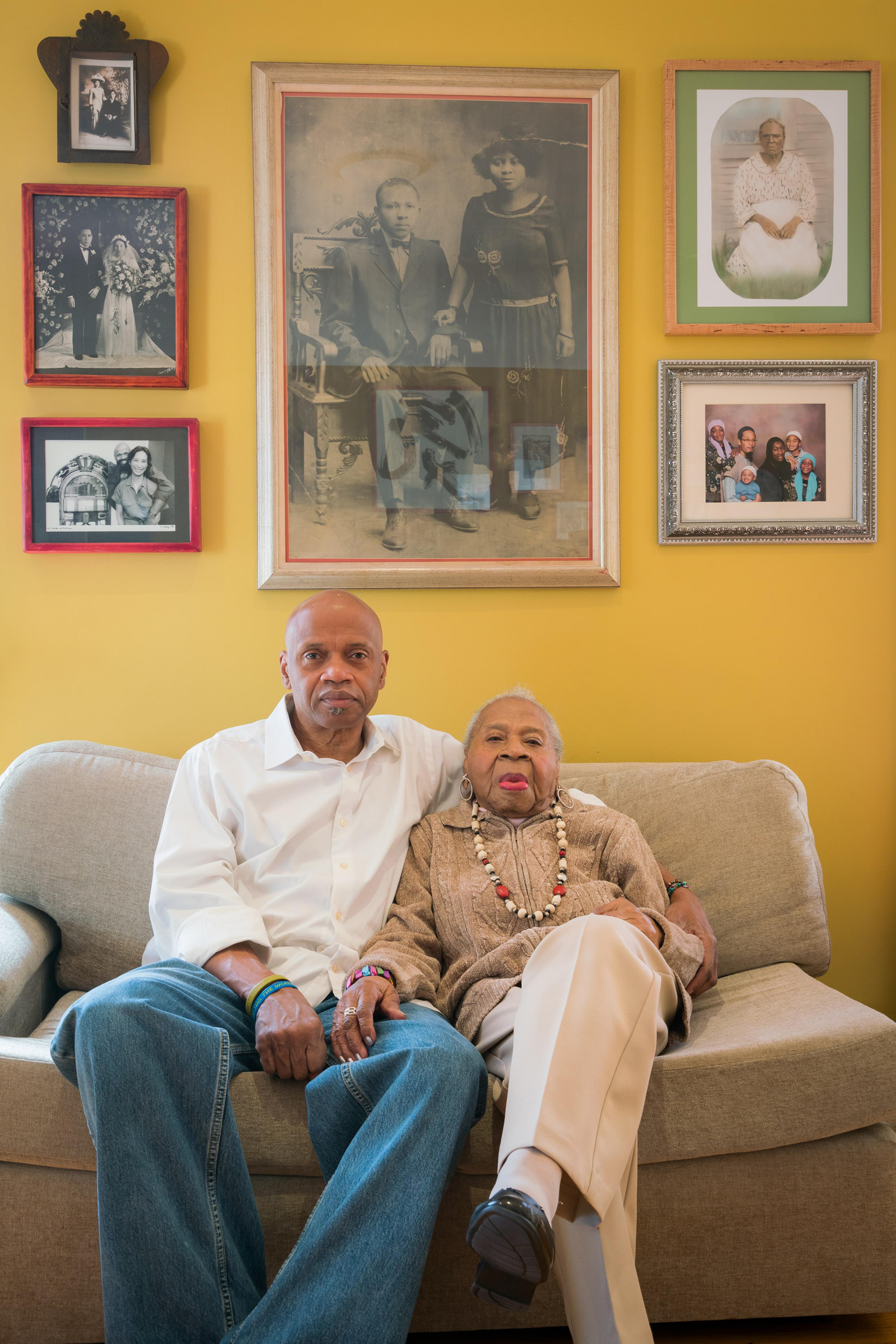 Tarabu Betserai Kirkland at home in Los Angeles with his mother, Mamie Lang Kirkland, 109, who fled Mississippi at age seven. 2017. (Photo: Kris Graves for the Equal Justice Initiative)