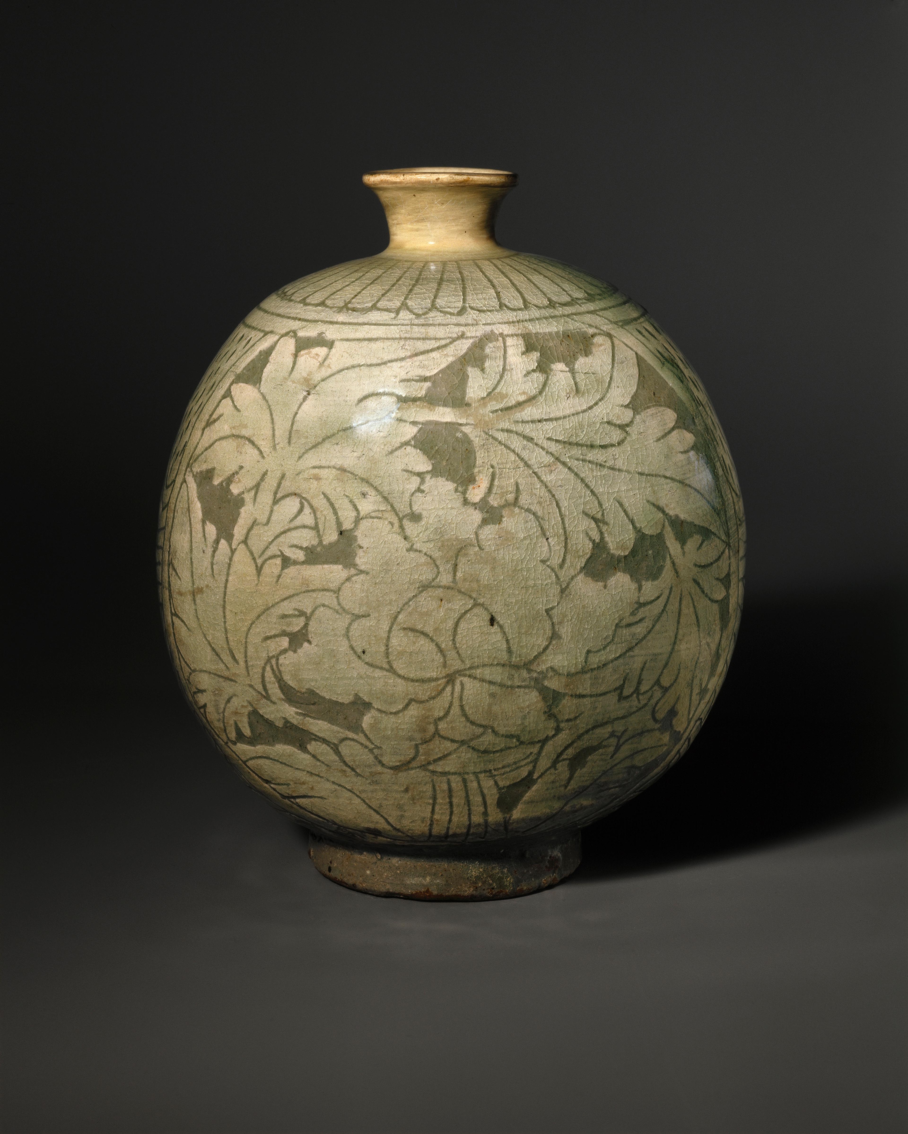 Bottle with Peony Decoration. Korea, Joseon dynasty, mid- to late 15th century. Stoneware with slip decoration under celadon glaze, 8⅝ x 7 x 6 in. (22 x 17.8 x 15.2 cm). Brooklyn Museum, Ella C. Woodward Memorial Fund, 75.61. (Photo: Brooklyn Museum)