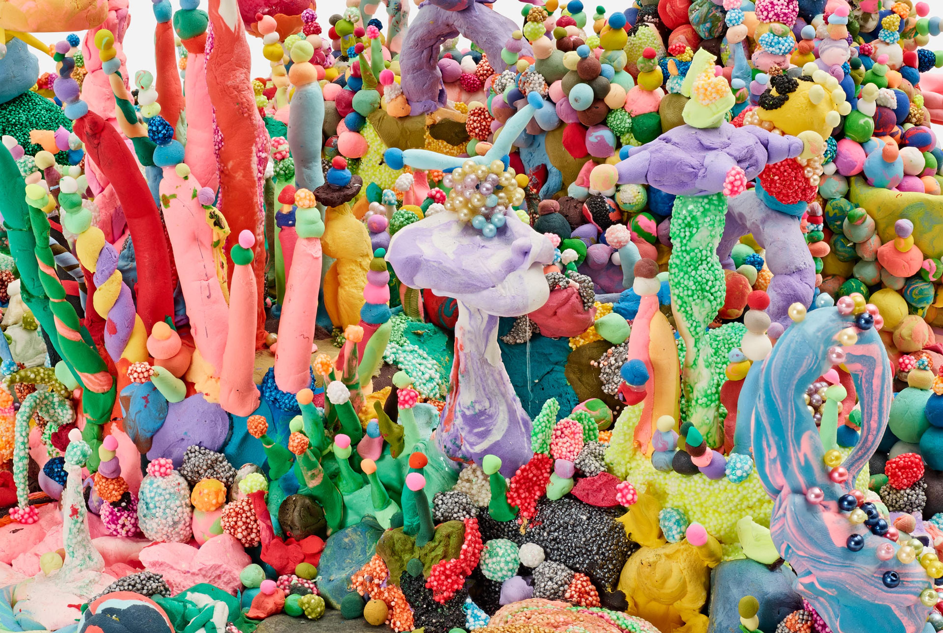 Close-up of a dense, colorful sculptural landscape