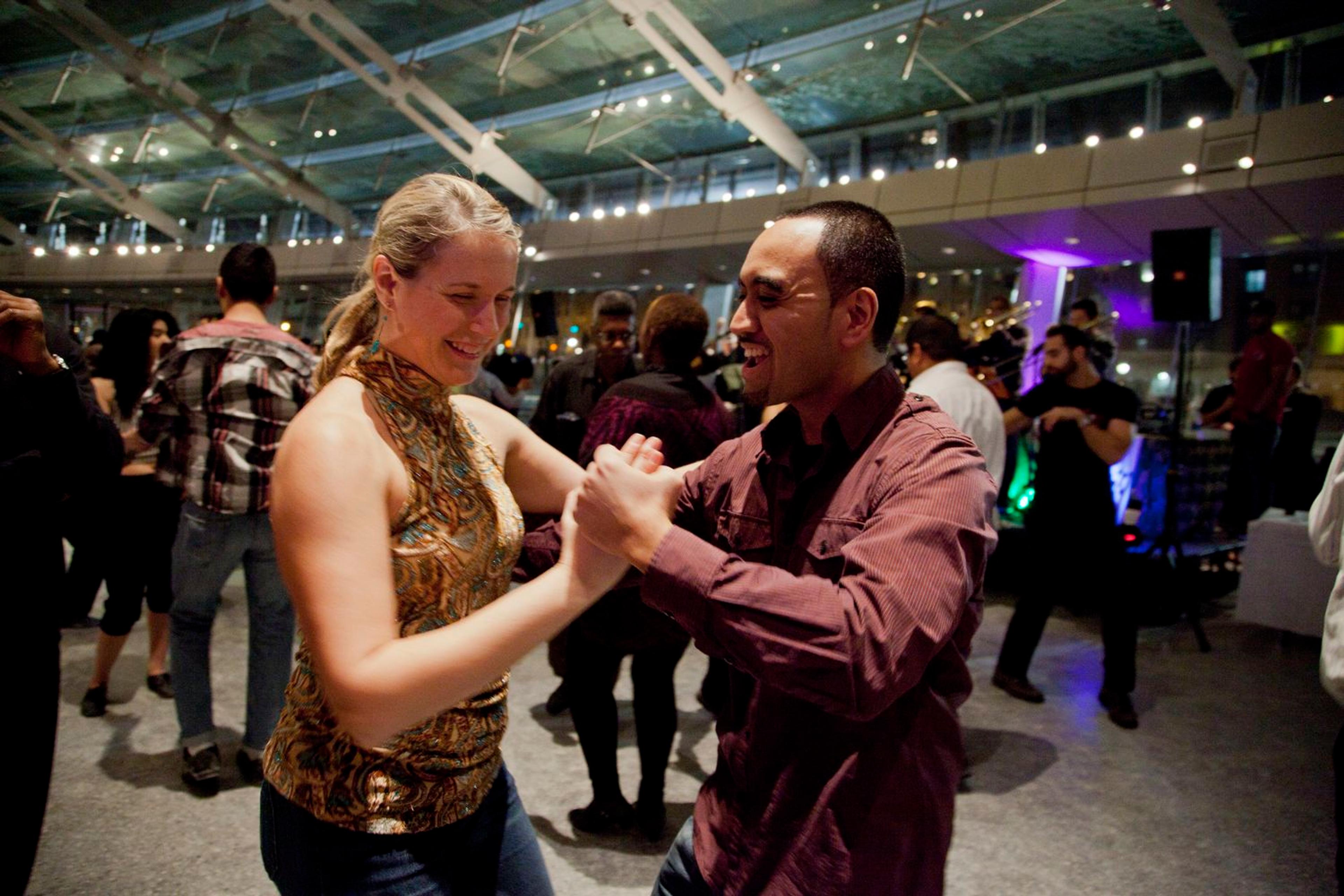 Two people salsa dancing