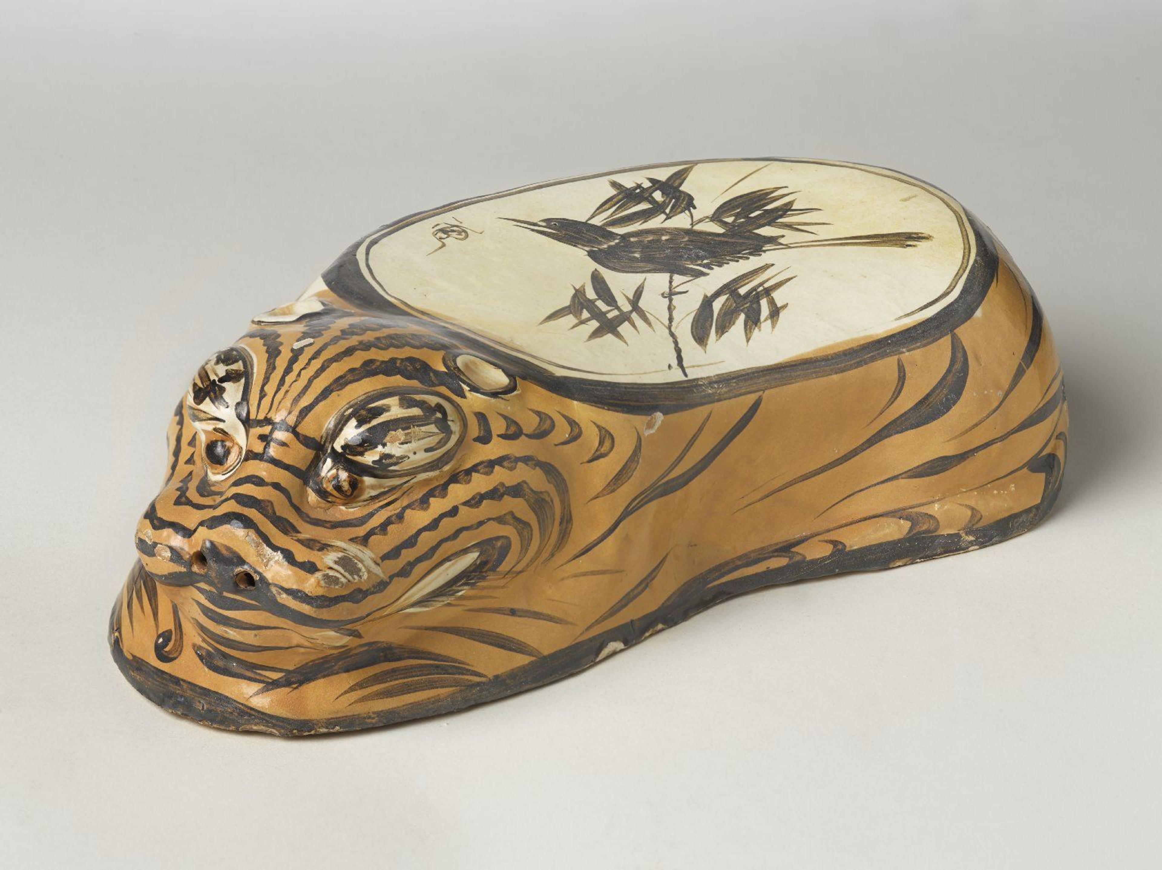 Cizhou Ware Pillow in the Form of a Tiger, 1182. Cizhou ware, earthenware, painted slip decoration with transparent glaze, 43/8 × 63/4 × 141/2 in. (11.1 x 17.1 x 36.8 cm). Gift of the Asian Art Council, 1993.56. (Photo: Brooklyn Museum)