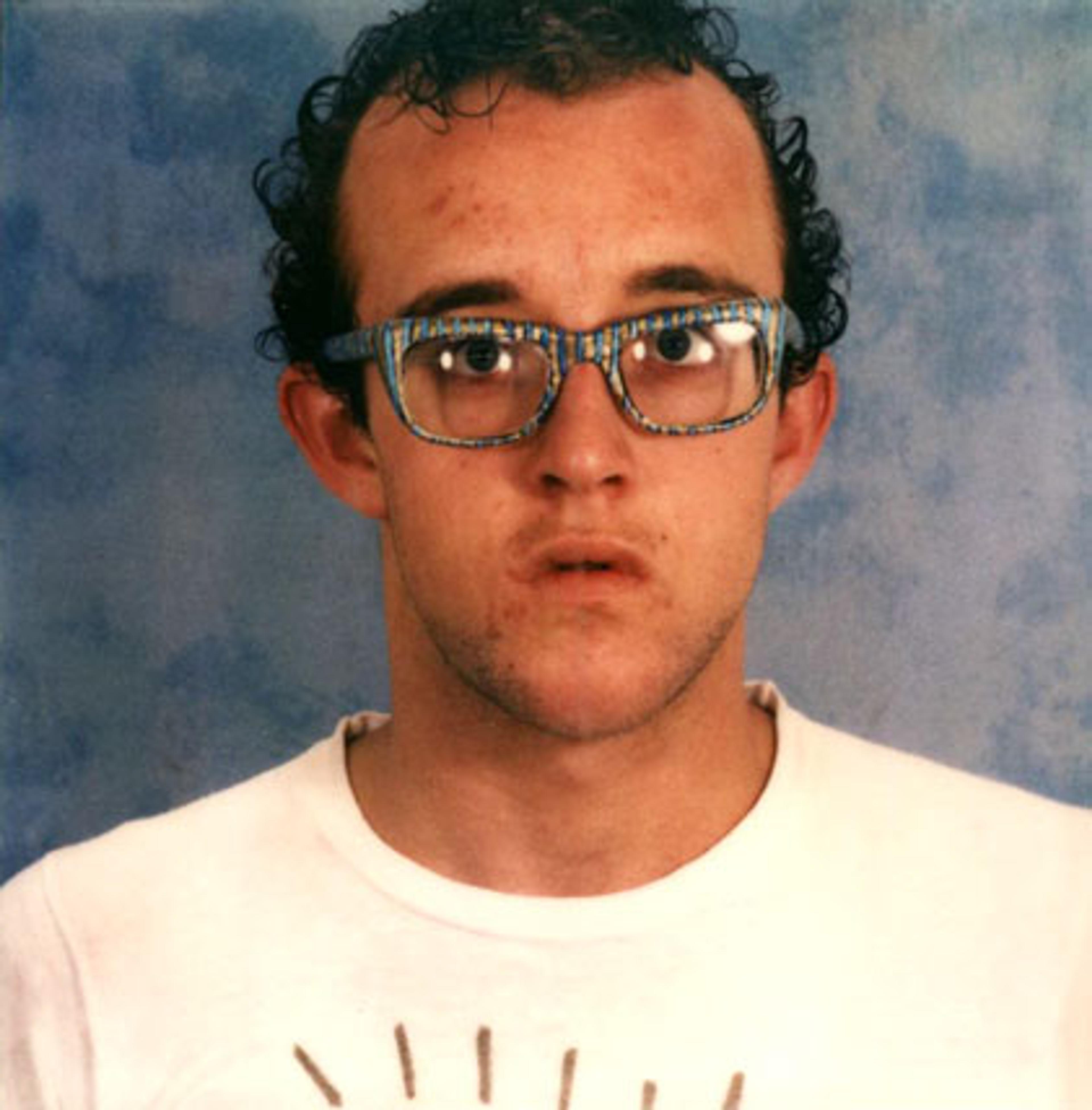 Keith Haring (American, 1958–1990). Self-Portrait with Glasses Painted by Kenny Scharf, circa 1980. Polaroid photograph. Collection Keith Haring Foundation. © Keith Haring Foundation