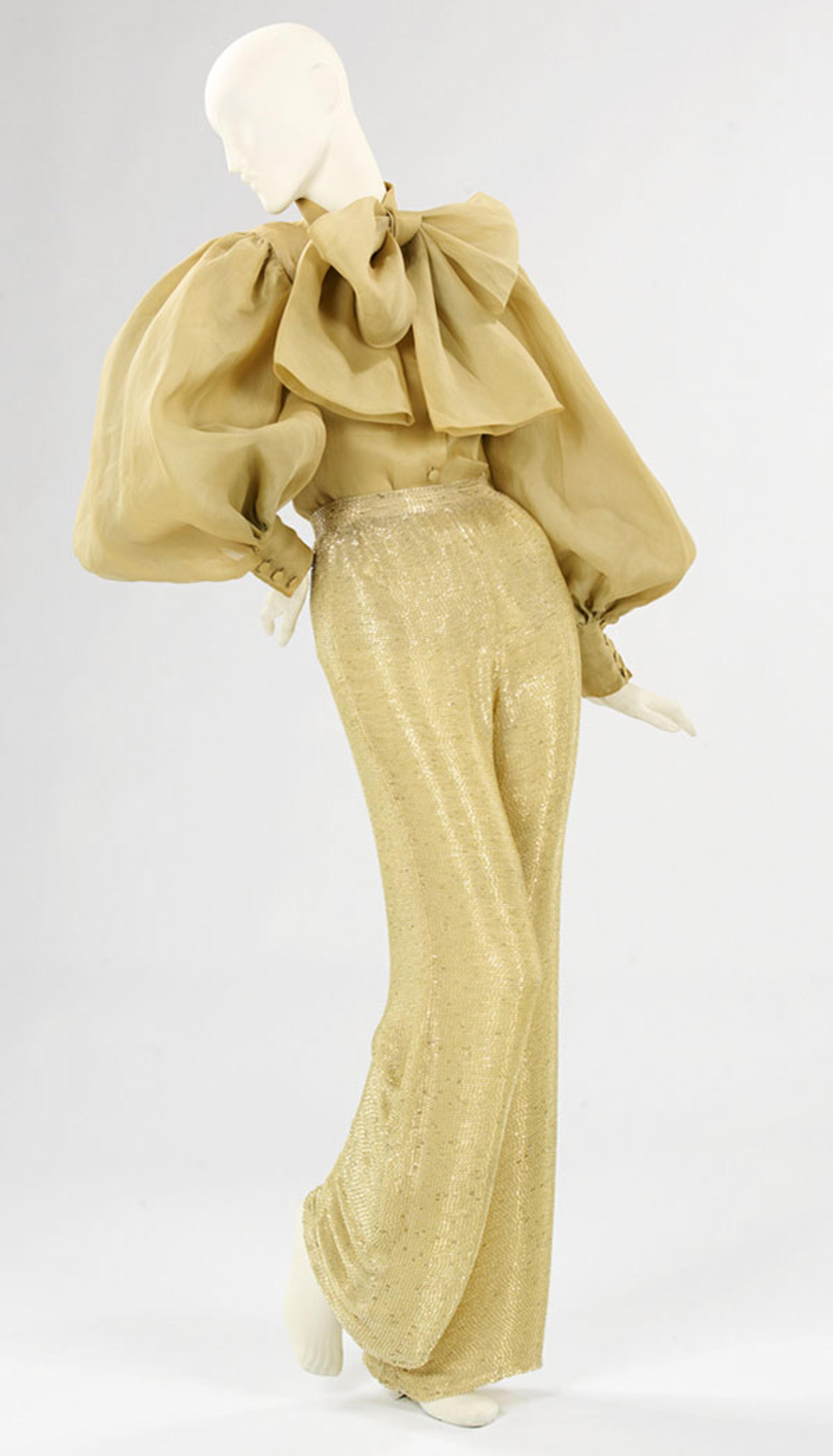 Norman Norell (American, 1900–1972). Evening Ensemble, 1970–71. Gold organdy, beaded gold silk jersey. Brooklyn Museum Costume Collection at The Metropolitan Museum of Art, Gift of the Brooklyn Museum, 2009; Gift of Toni Tavan Ausnit, 1990 (2009.300.1383a–b)