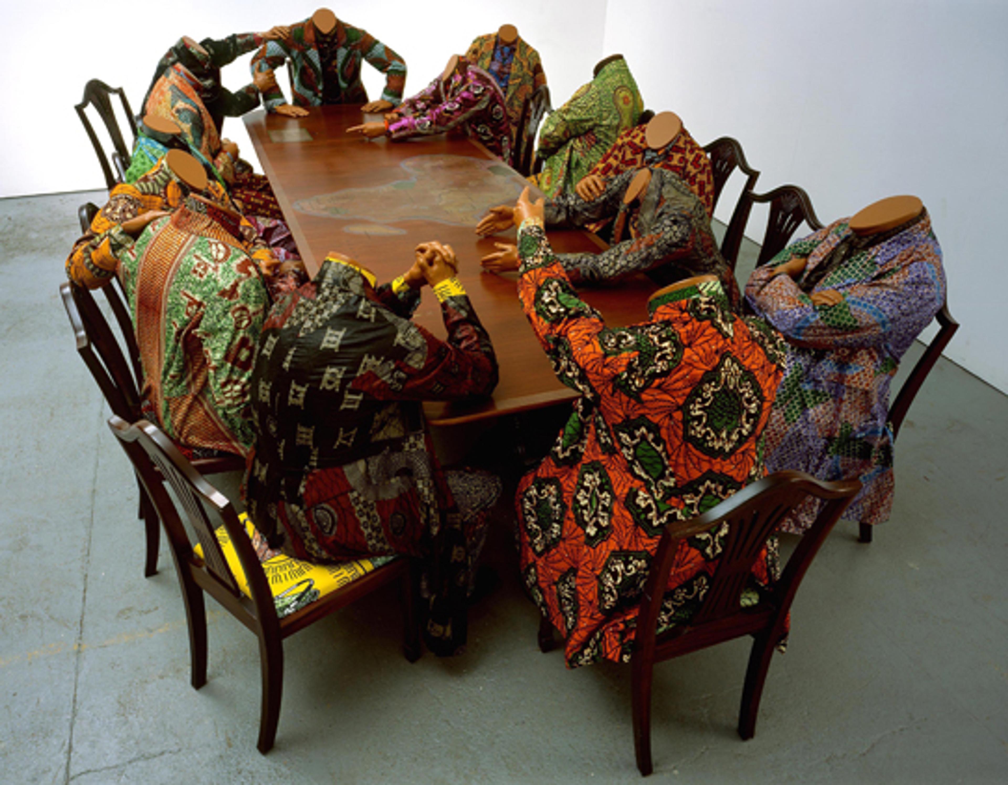 Yinka Shonibare MBE (b. United Kingdom, 1962). Scramble for Africa, 2003. Fourteen life-size fiberglass mannequins, fourteen chairs, table, Dutch wax printed cotton, 52 × 192 × 110 in. The Pinnell Collection, Dallas. Image courtesy of the artist, Stephen Friedman Gallery, London, and James Cohan Gallery, New York. © the artist. Photo: Stephen White