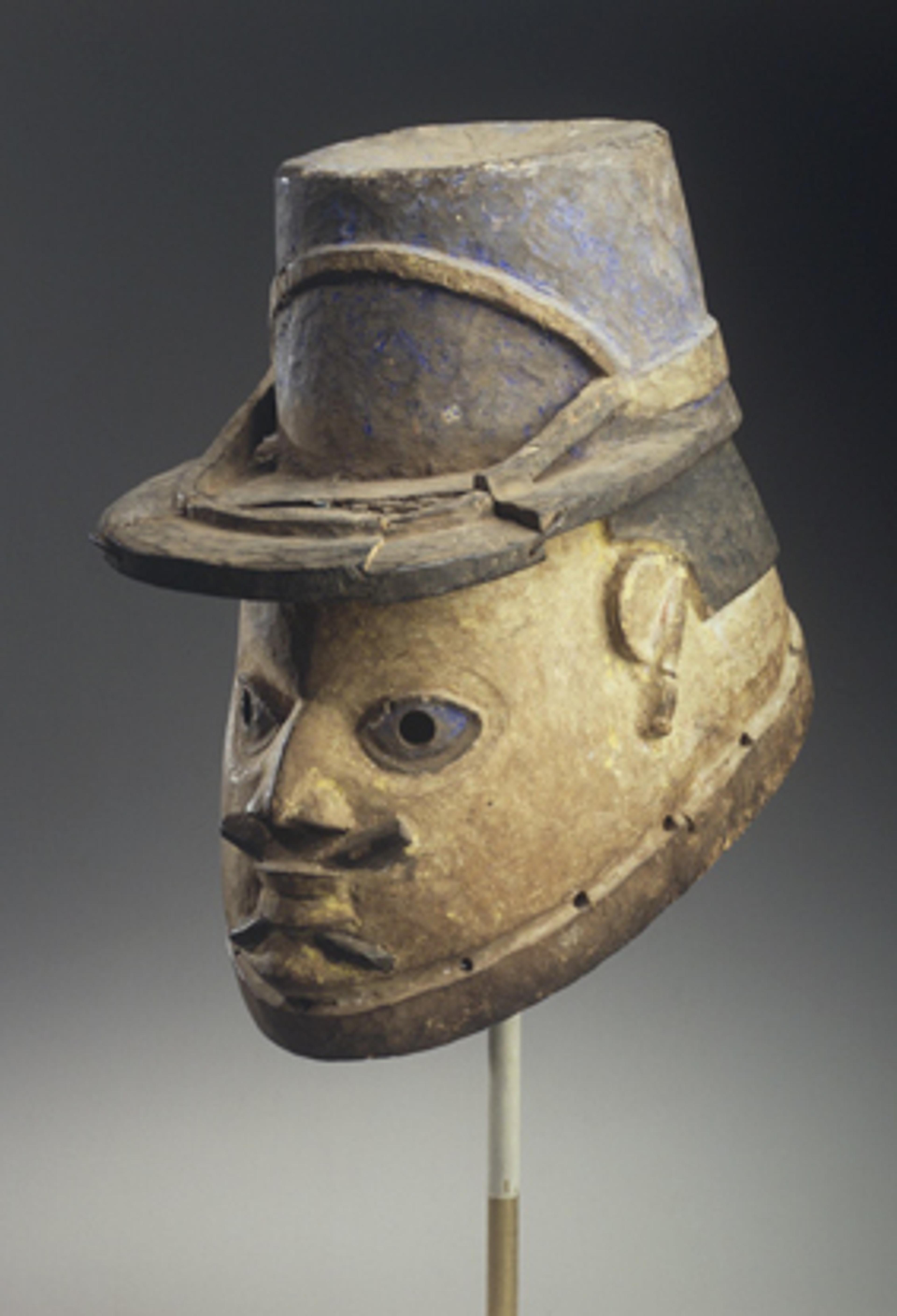 Gelede Mask of a French Gendarme. Unidentified Yoruba artist, late 19th or early 20th century. Benin. Wood, pigment, 10 × 7 × 11 in. (25.4 × 17.8 × 27.9 cm). Gift of Eugene and Harriet Becker, 1991.226.3