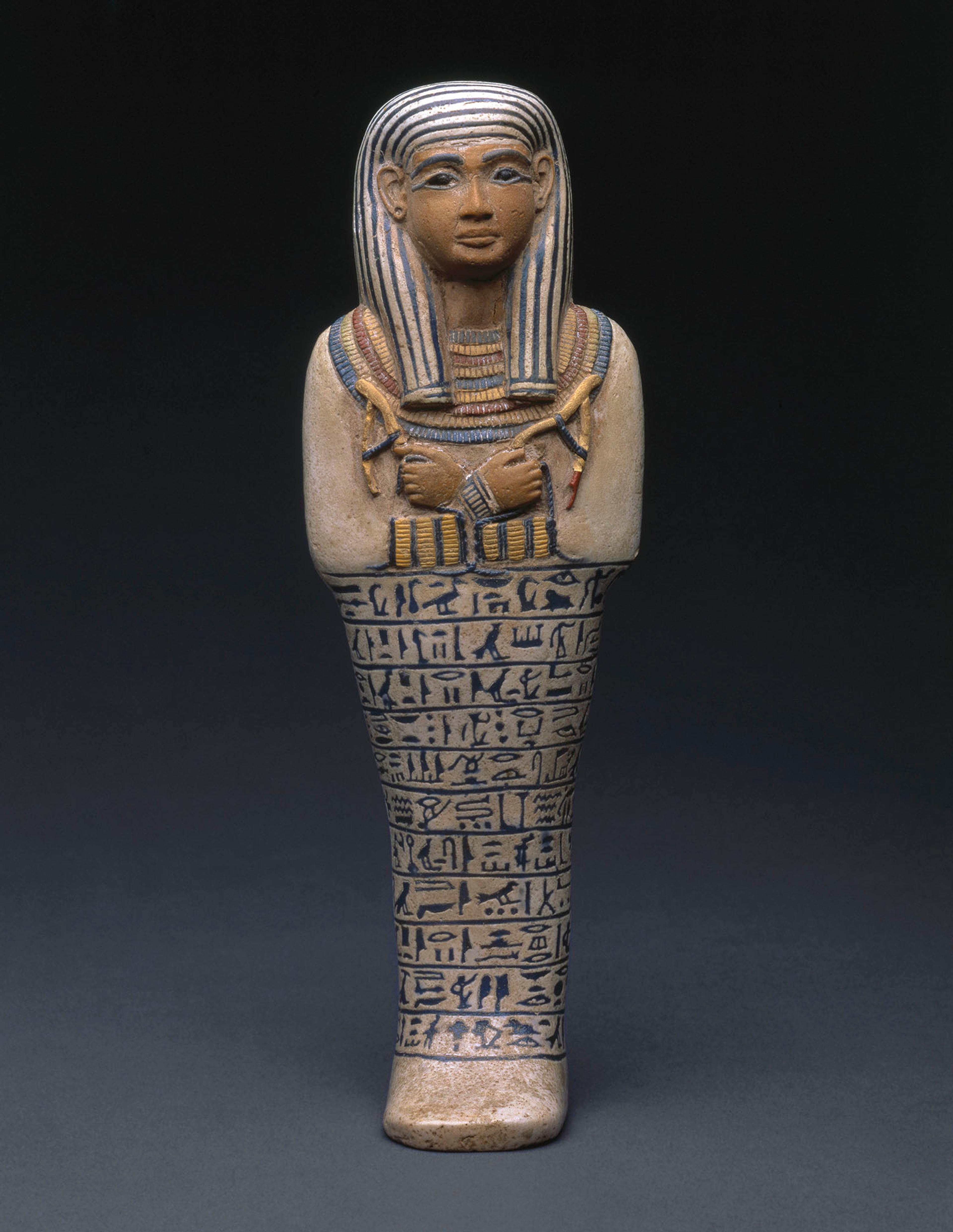 Shawabti of the Lady of the House Sati, circa 1390–1352 B.C.E. Faience, Height 97/8 in. (25 cm). Charles Edwin Wilbour Fund, 37.124E. (Photo: Brooklyn Museum)